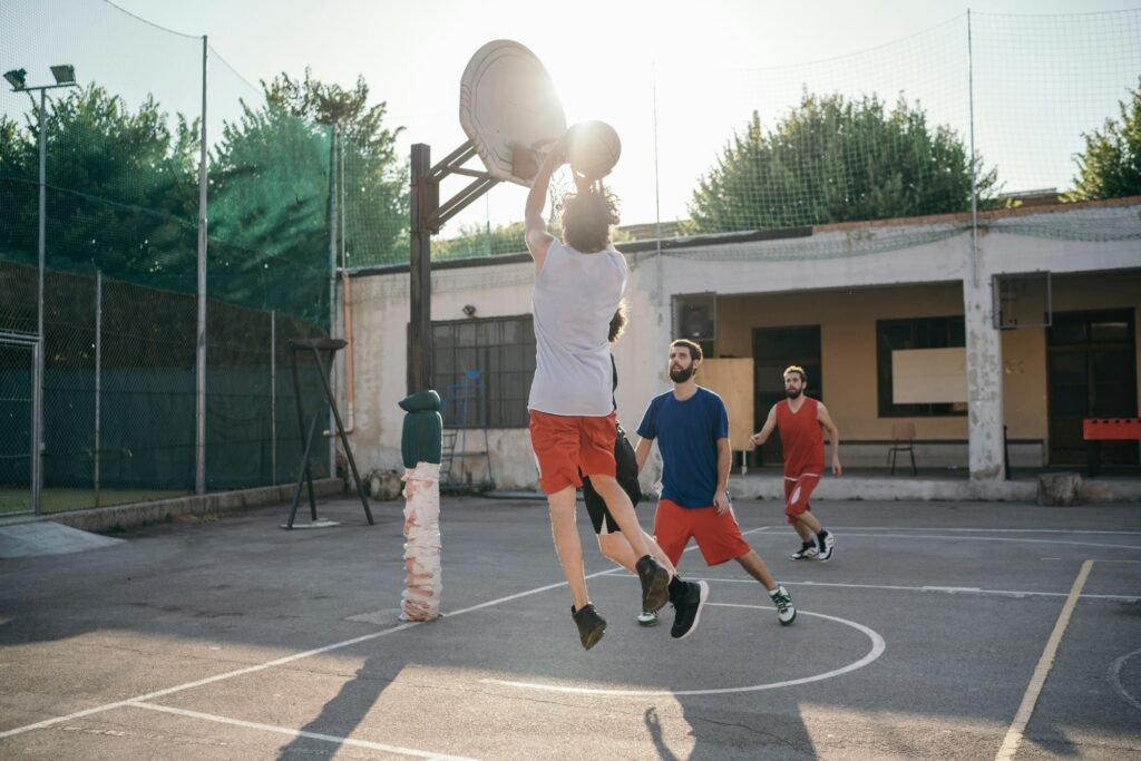 Friends on basketball court playing basketball game